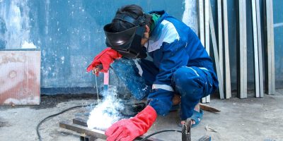 Worker Welding Steel